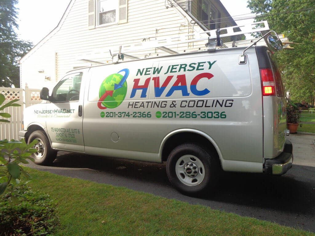 New Jersey HVAC van parked in driveway, showcasing heating and cooling services with contact information.