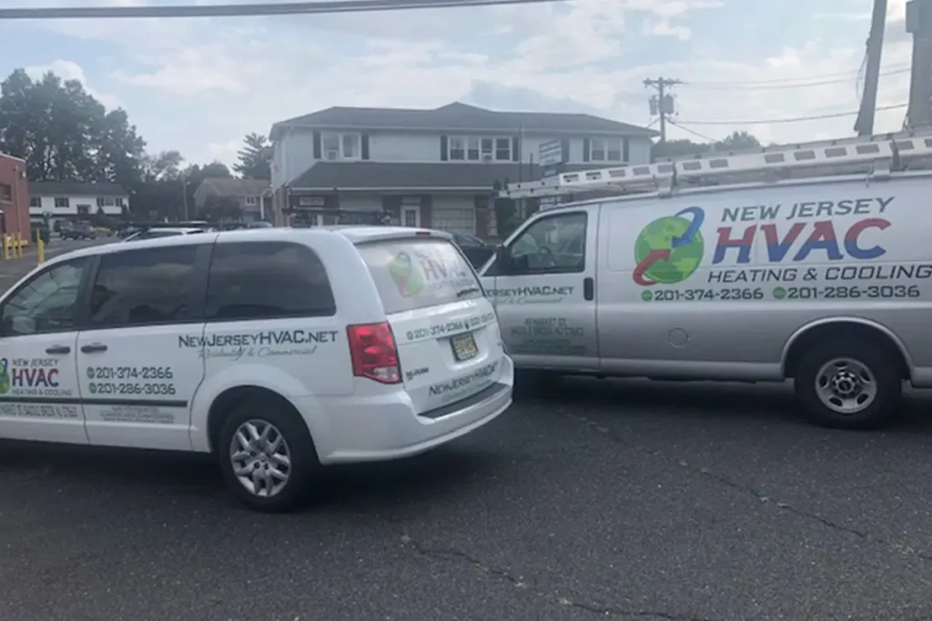 New Jersey HVAC service vans parked, showcasing heating and cooling company branding with contact details.