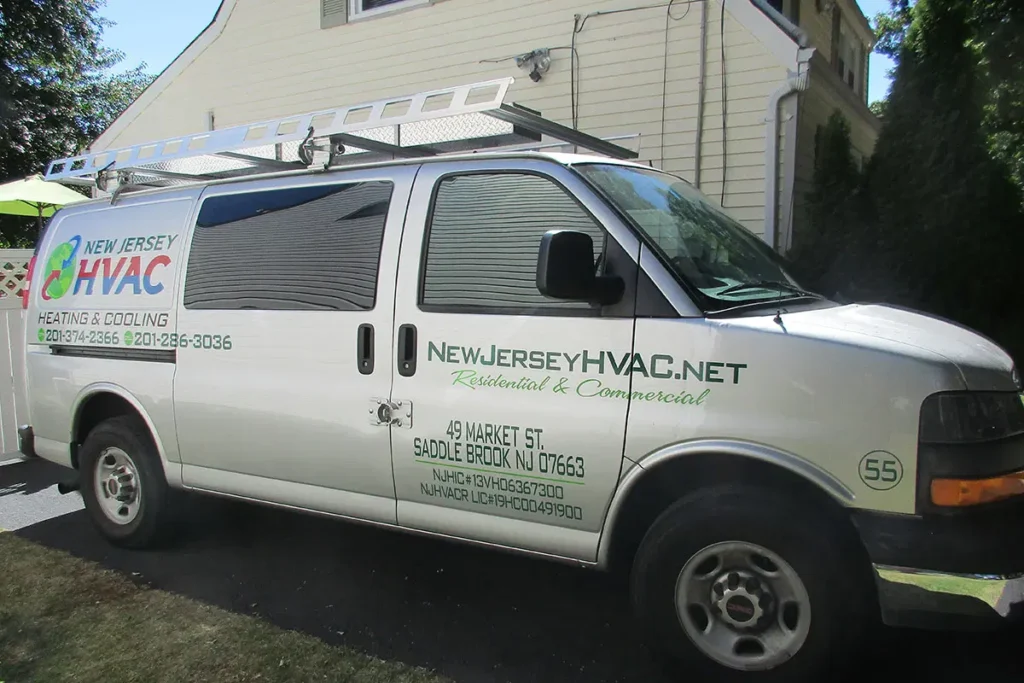 New Jersey HVAC service van with branding, contact info, and ladder, parked outside a residential home.