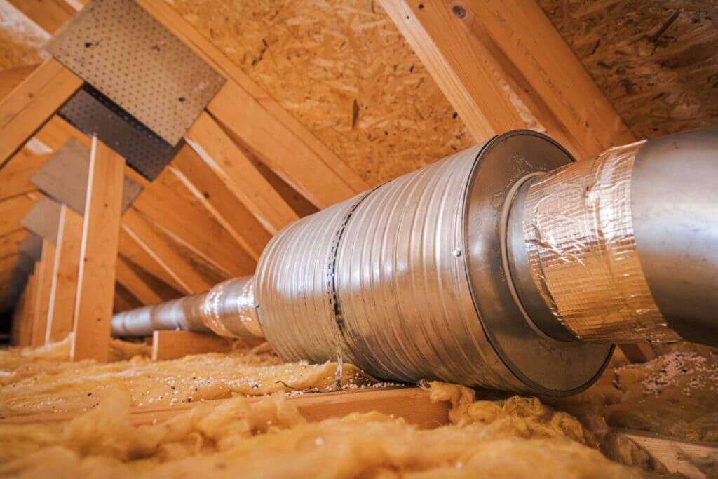 Attic air ventilation duct with insulation for efficient home air filtering and temperature control system.